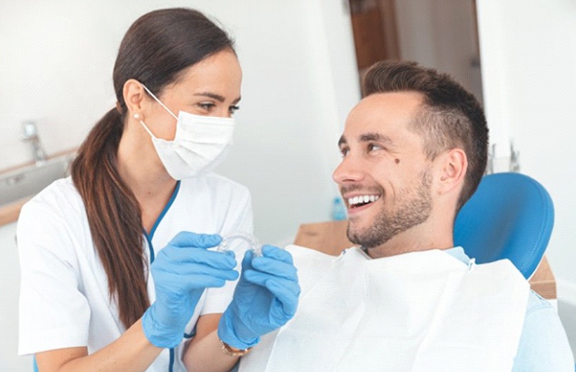 dentist in Rocky Hill explaining Invisalign to a patient