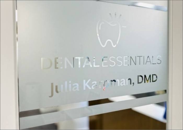 Logo of Dental Essentials displayed inside the building, featuring a clean and modern design