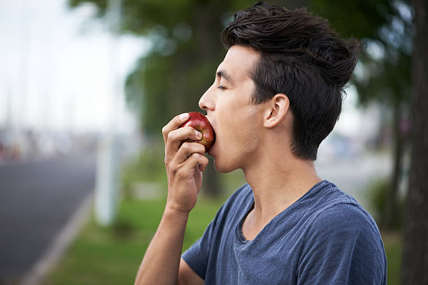 person eating an apple with fluoride in it 